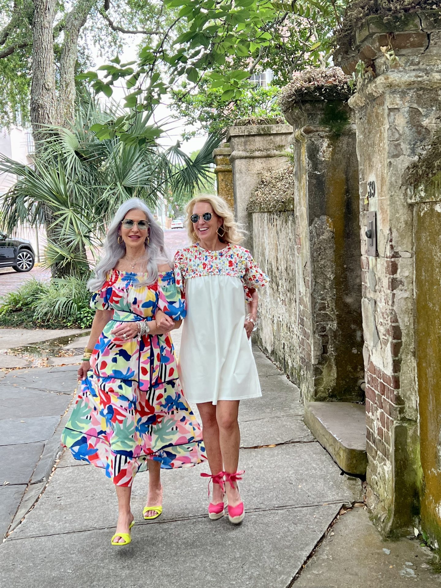 ladies wearing floral dresses walking