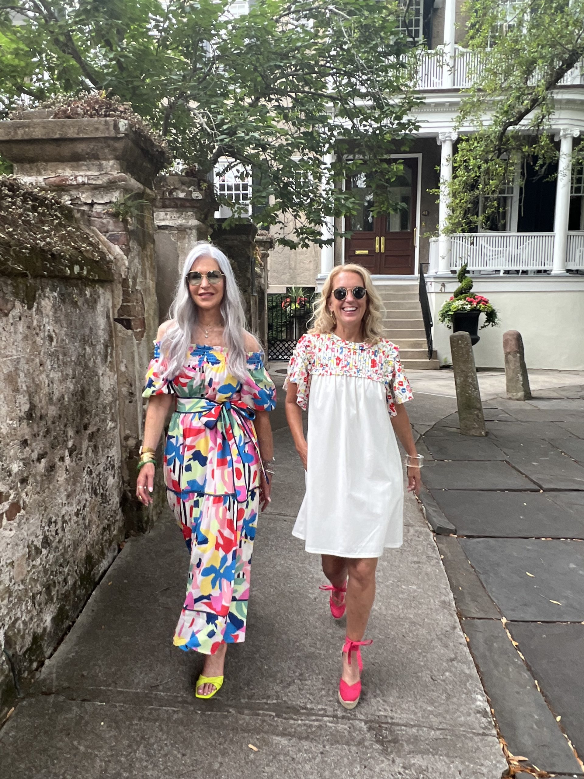 women wearing floral dresses walking in charleston