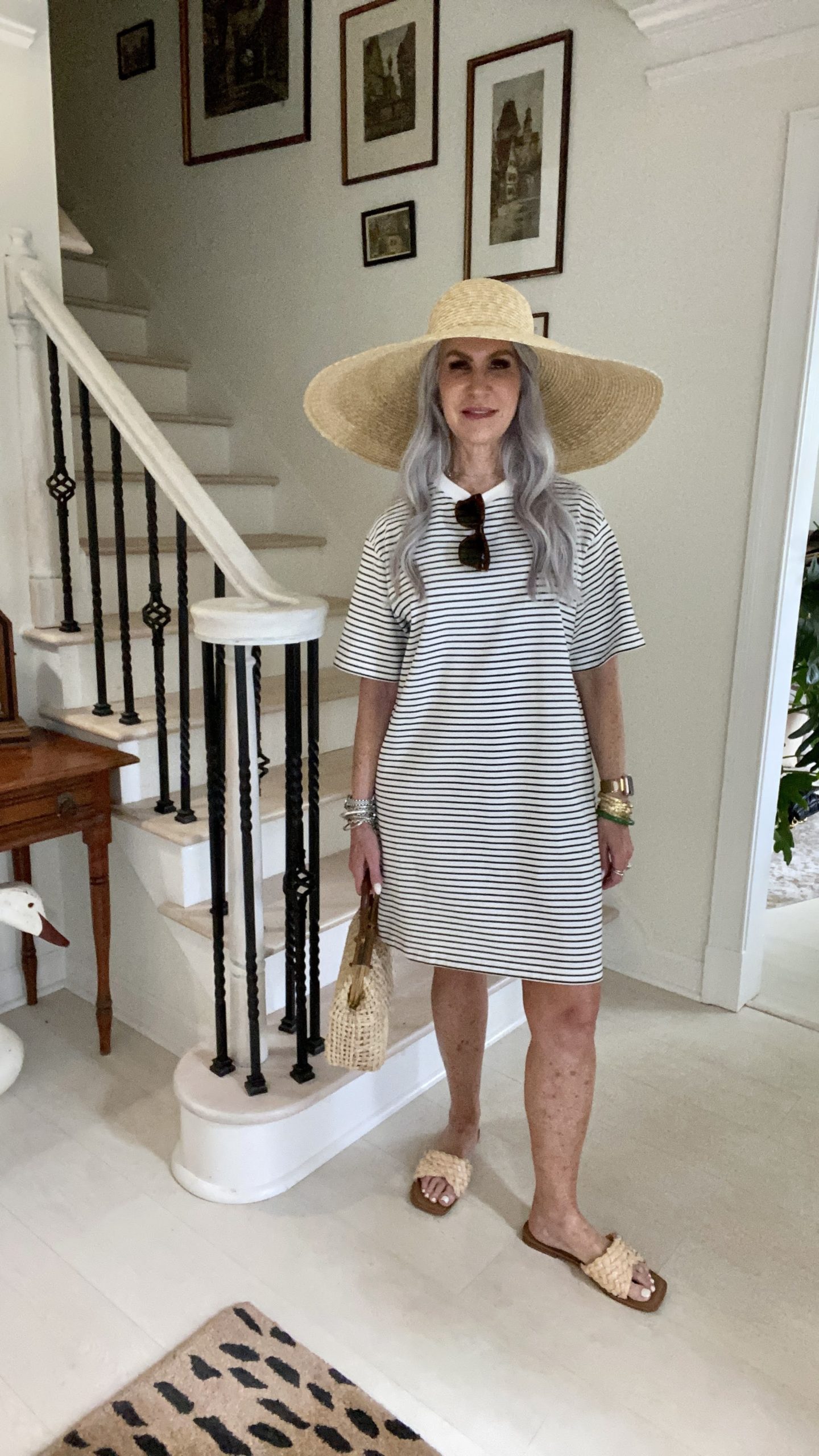 lady wearing striped t-shirt dress with straw hat