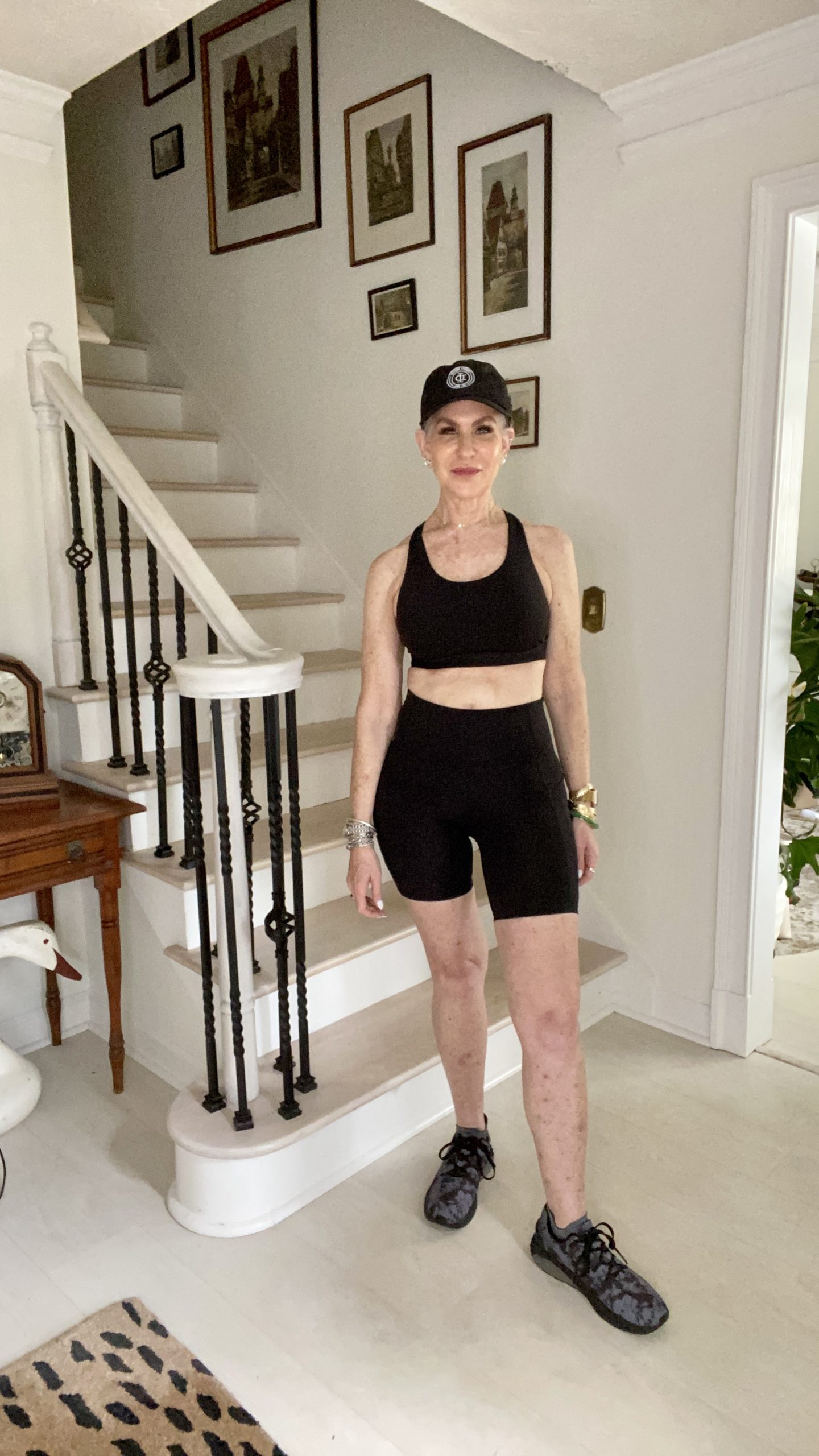 woman wearing biker shorts and sports bra