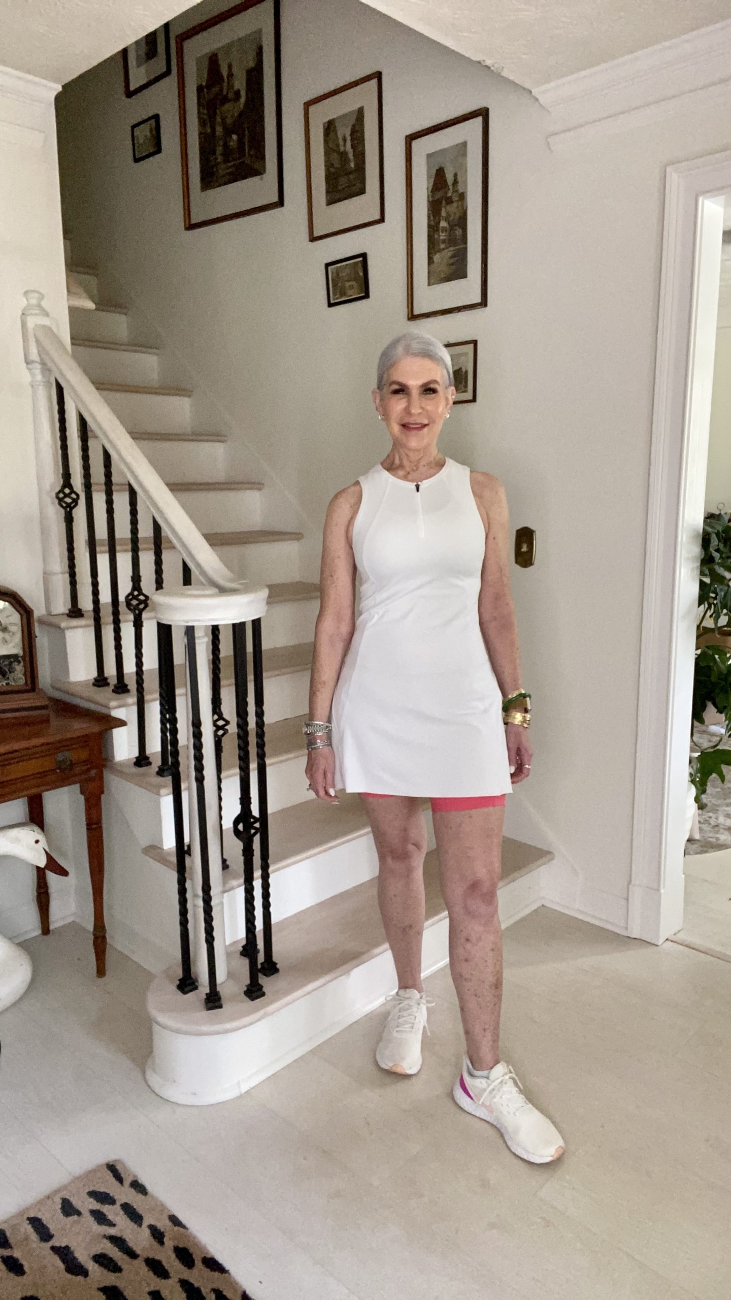 Woman wearing white tennis dress