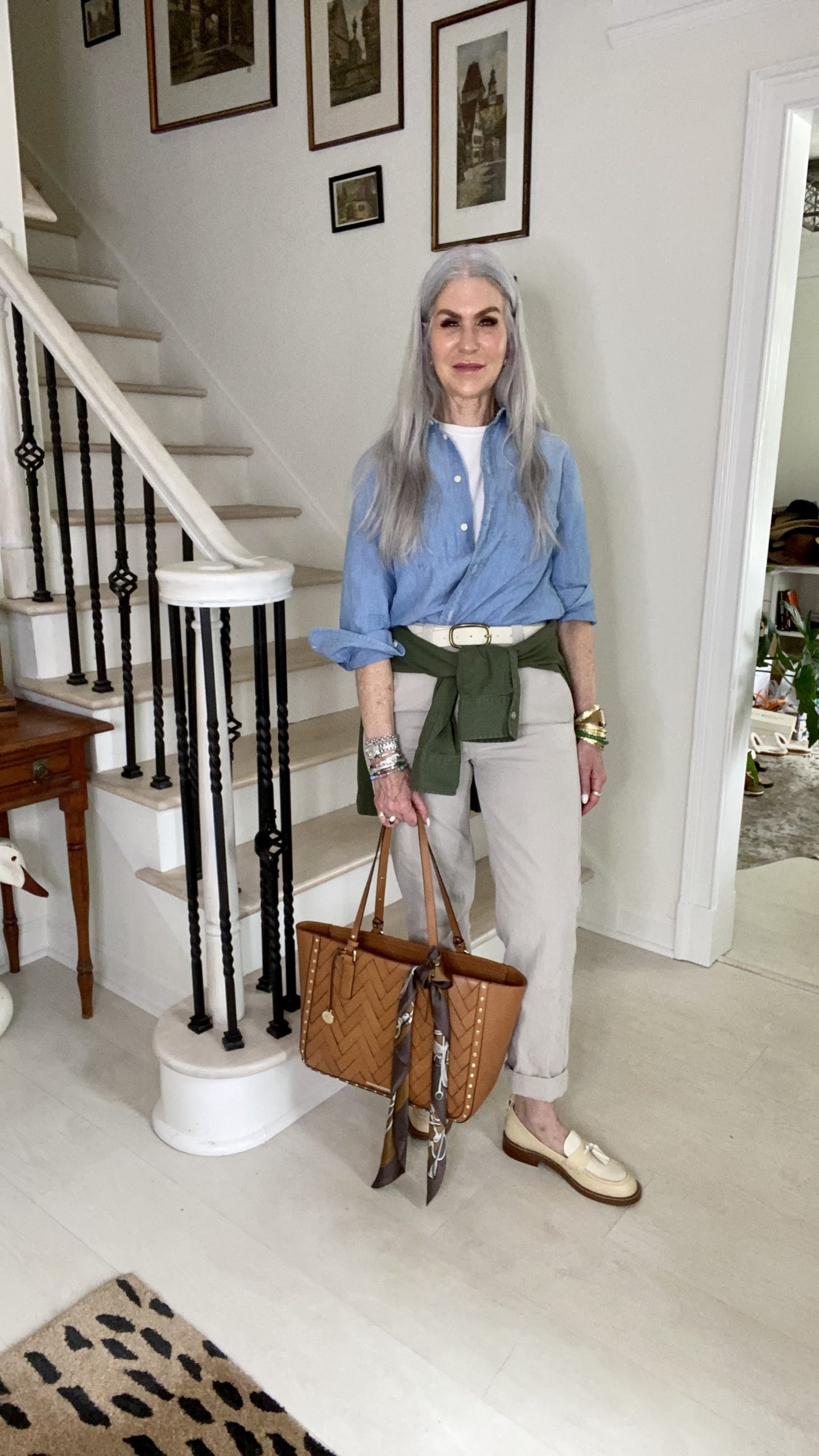 lady wearing layered outfit with bag