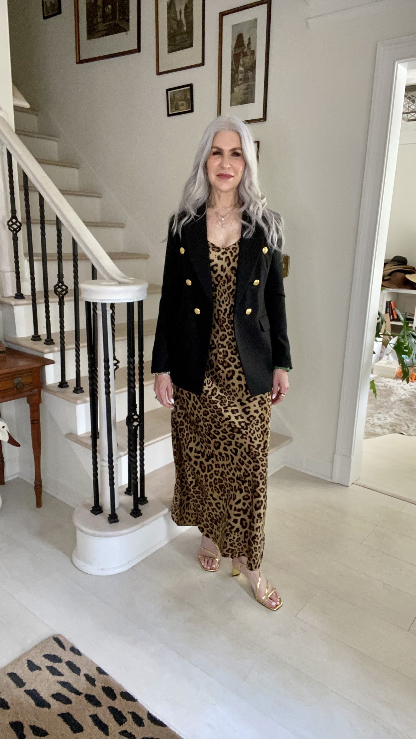 silver hair lady wearing leopard print dress and black blazer