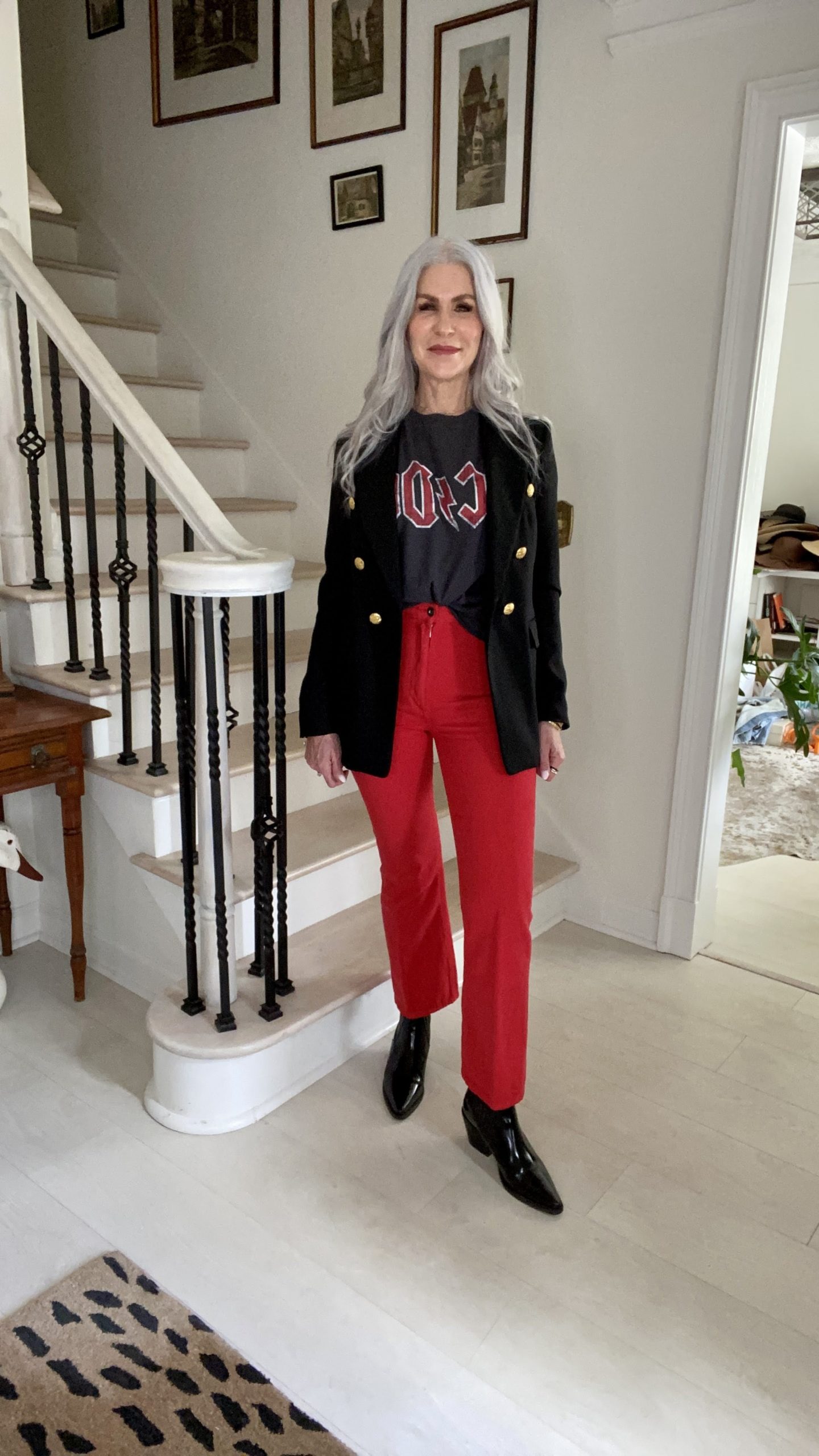 silver hair lady wearing rock n roll shirt and red pants