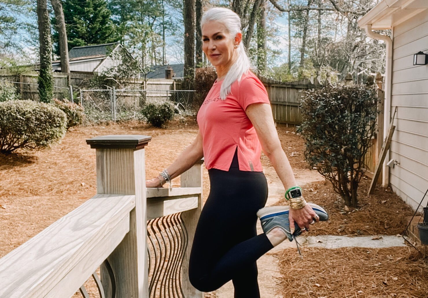 lady wearing athleisure clothing and stretching